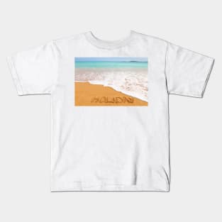 Inscription "HOLIDAY" made on beautiful beach by the blue sea Kids T-Shirt